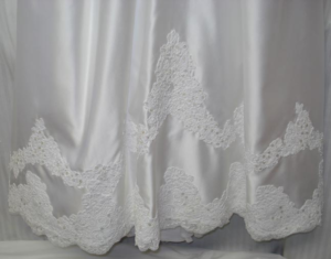 alt="After 2 of Wedding Gown Restoration. 1990's Wedding Dress restored after improper storage."