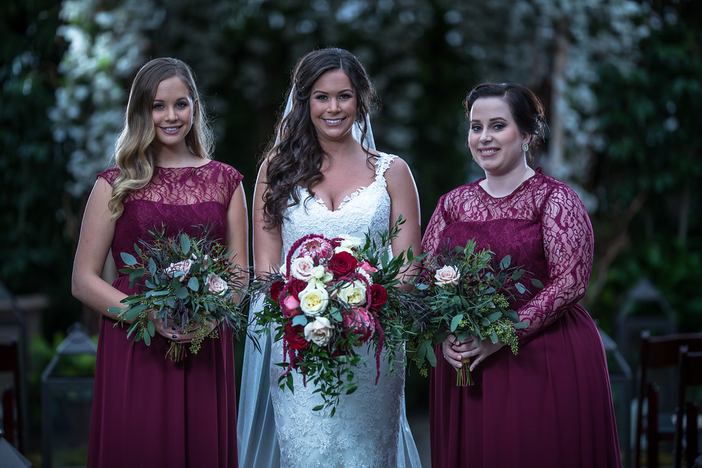 Bride with two brides maids in maroon