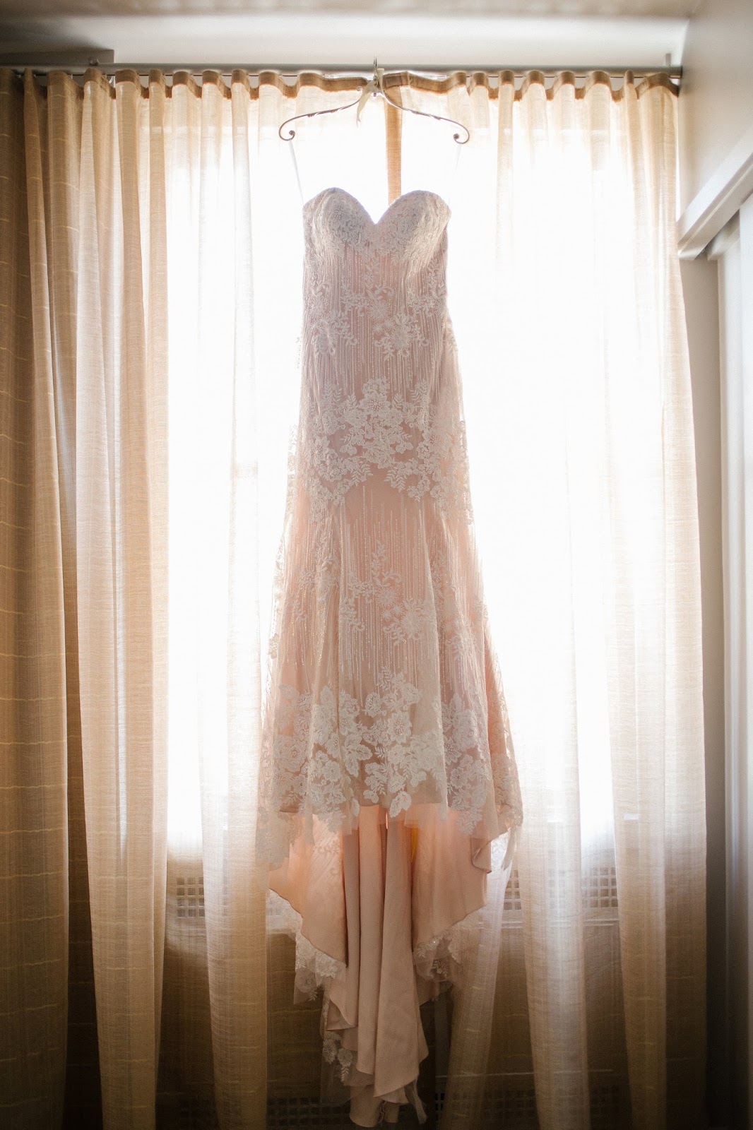 Pink wedding dress hanging up