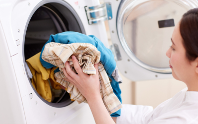 loading clothes into a washer